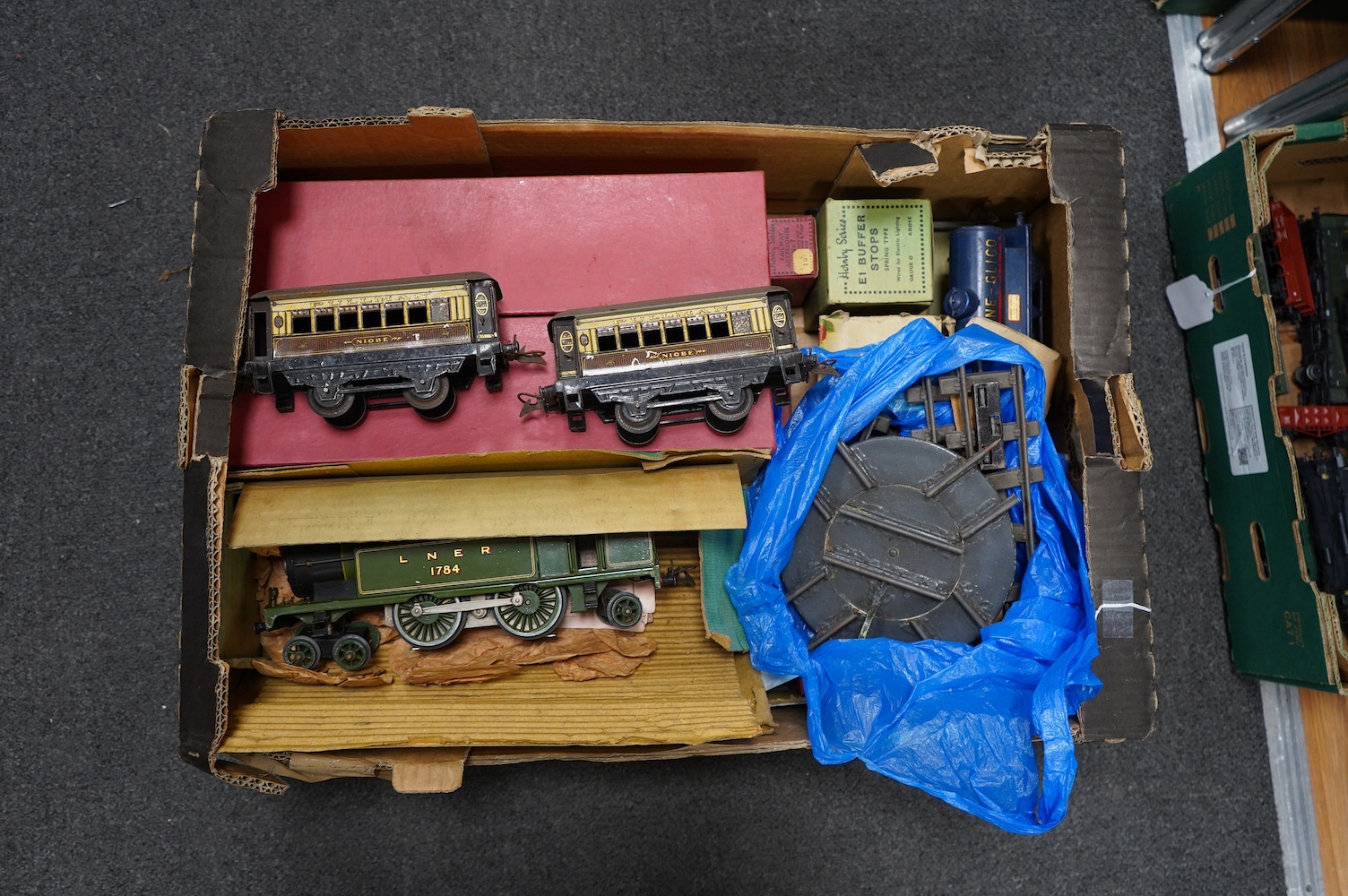 Twenty-four HO gauge model railway by Lima, Trix, Fleischmann, etc. including a German DB 4-6-2 tender locomotive, 10 001, fourteen Continental outline bogie coaches, 4-wheel coaches, and freight wagons. Condition - fair